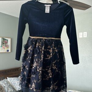 She'll stand out at her next special occasion with this dress by Bonnie Jean!